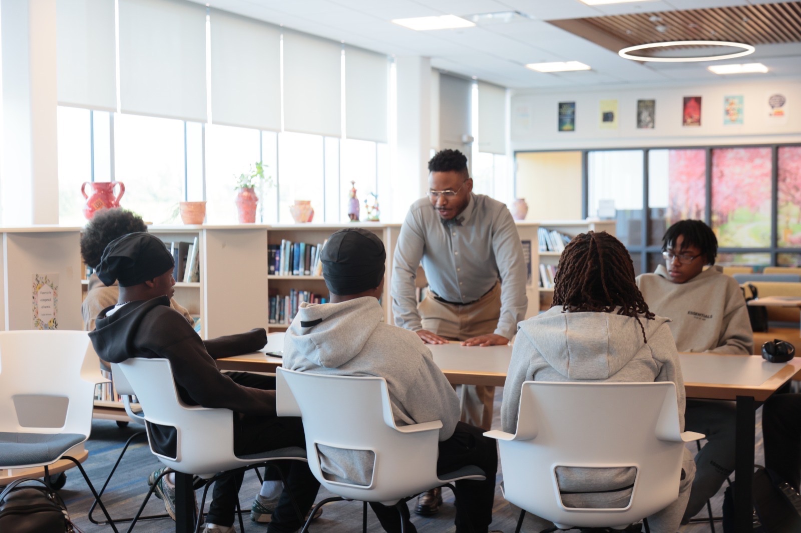 Ace Clark leading a session with high school scholars in a school library