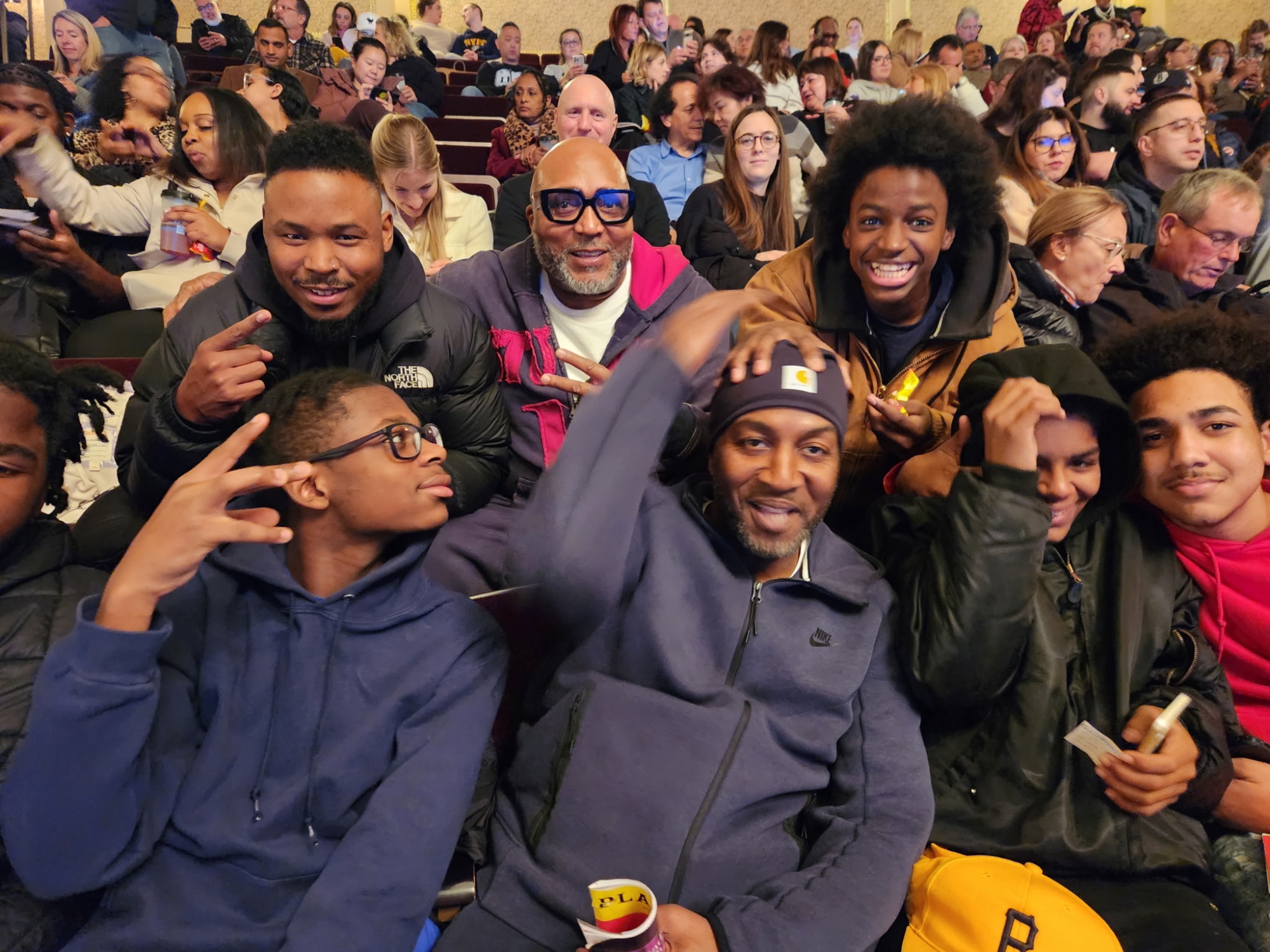 Scholars and mentors in their seats before a live show